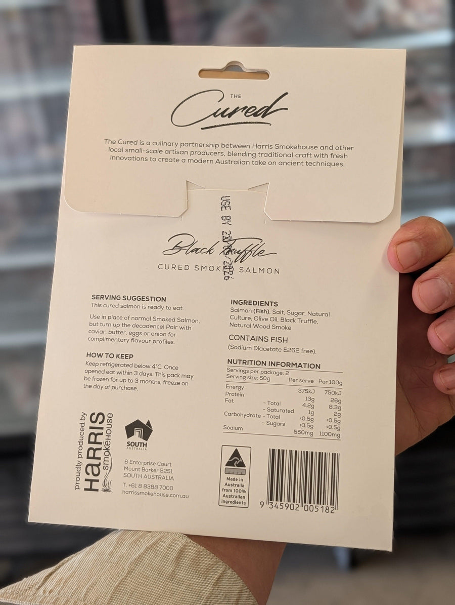 Product packaging with text and branding held by a person — view 3