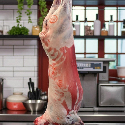 mutton body hanging in a kitchen setting with shelves and utensils in the background.