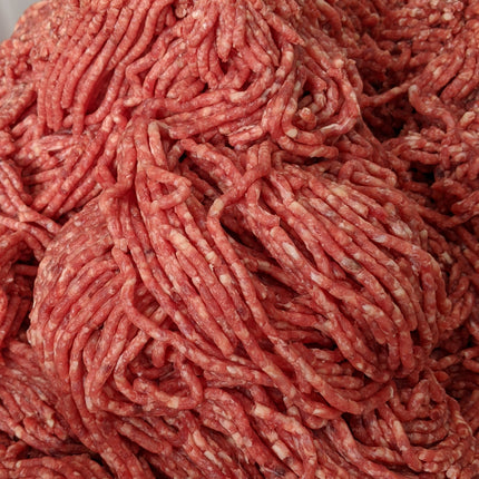 Close-up of ground meat on a white background